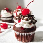 Black Forest Cupcakes recipe with cherry filling and chocolate shavings